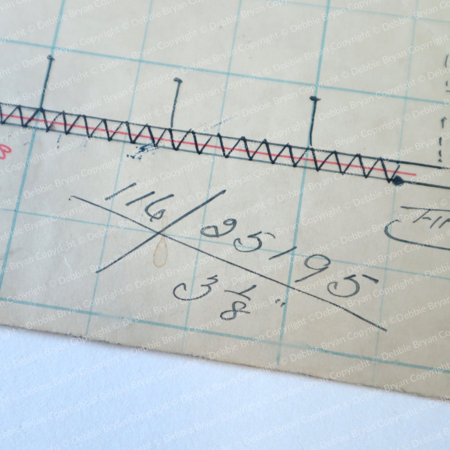 Measurement tool with grid background and measurements written on it