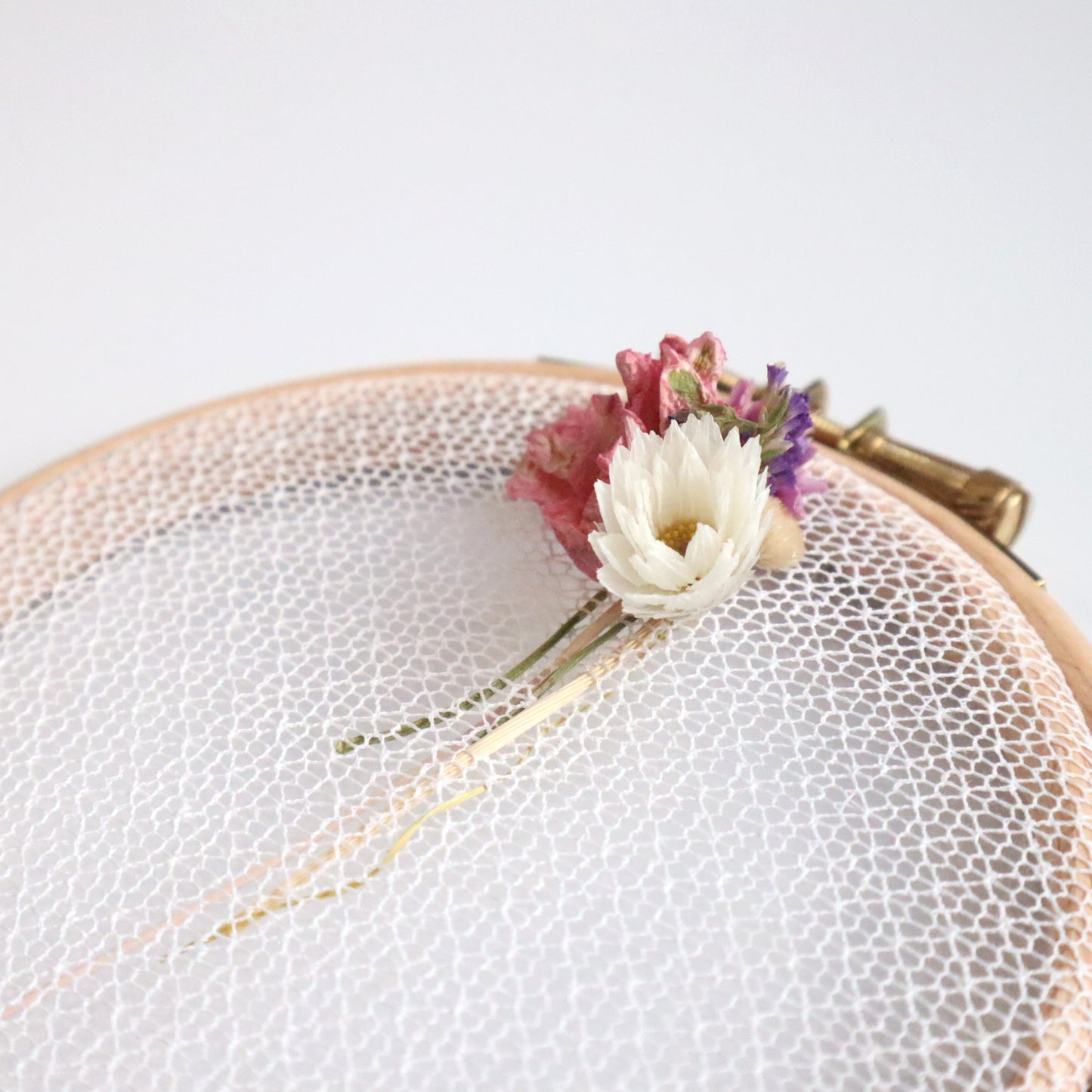 Nottingham Lace tulle in an embroidery hoop with dried flower details