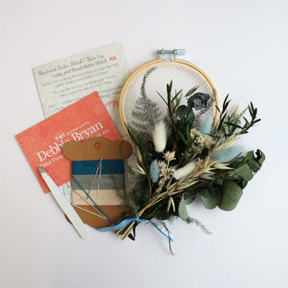 Contents of a dried flower embroidery craft kit which includes Nottingham Lace tulle in an embroidery hoop, dried flower bunch, embroidery threads and how-to instructions