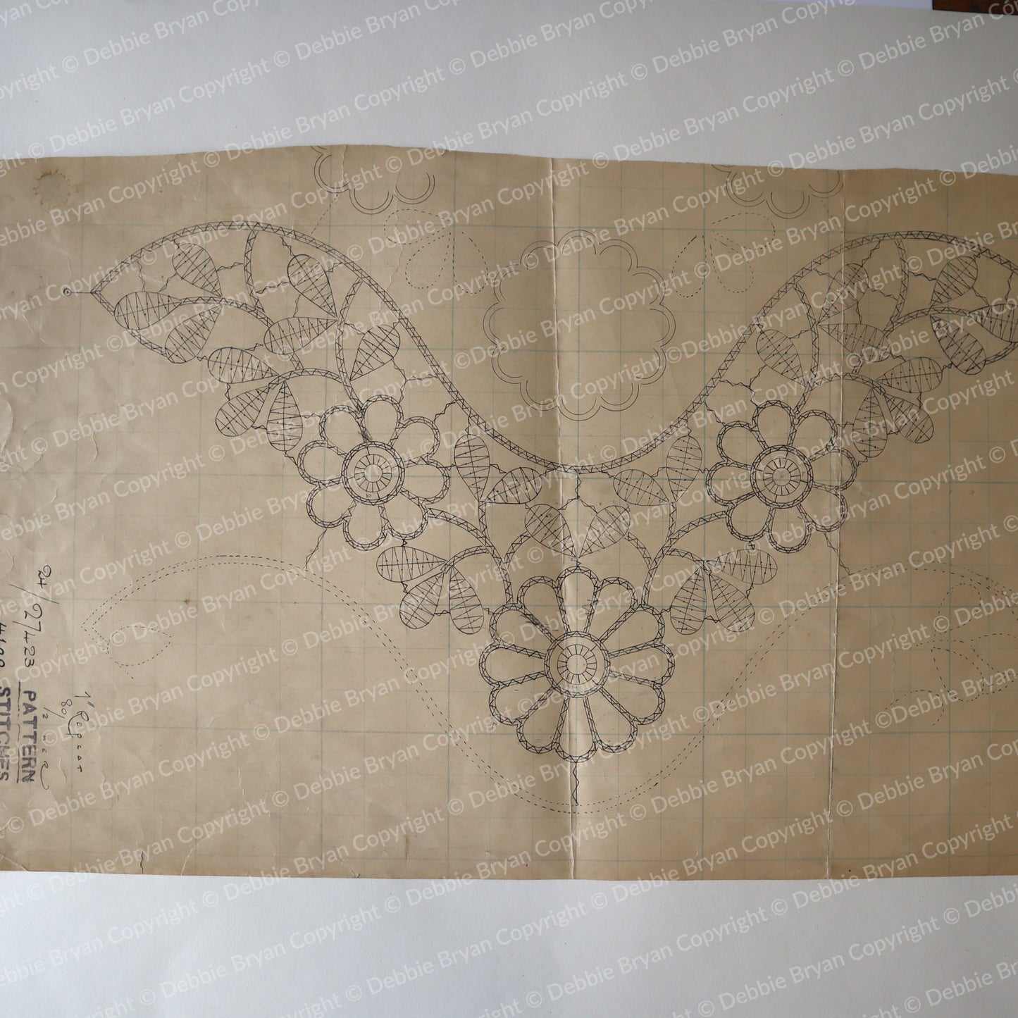 Design of a floral pattern on brown paper with 'Debbie Bryan' branding.