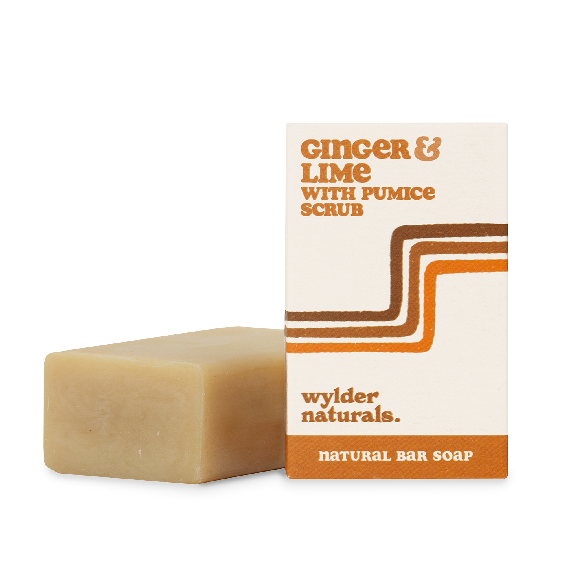 A natural bar soap. The packaging is beige with orange and brown accents, and text reads 'Ginger & Lime with Pumice Scrub, natural bar soap, wylder naturals'.