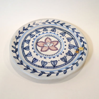Image of just a saucer on a white background