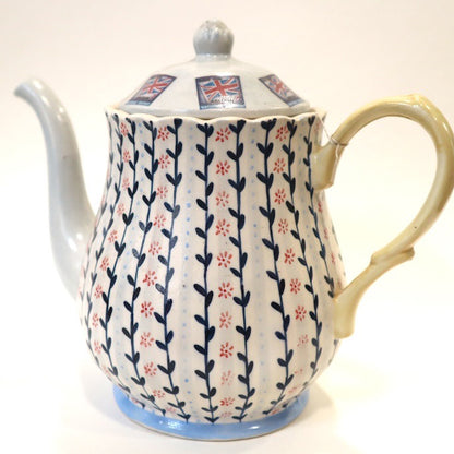 Ceramic teapot with floral pattern and Union Jack design on a white background