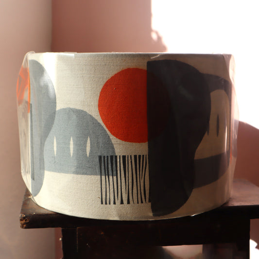 geometric patterned lampshade on a pink background
