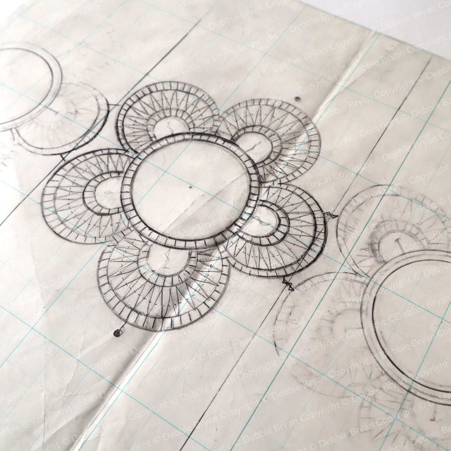 Technical drawing of a circular design on graph paper