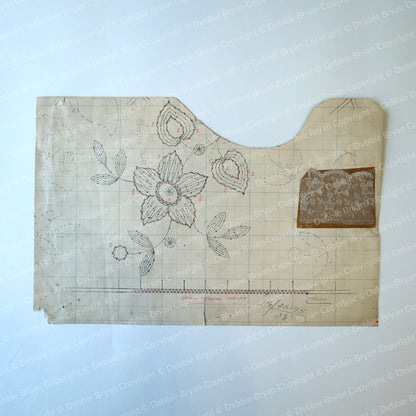 Vintage paper lace pattern with floral designs on a off white background