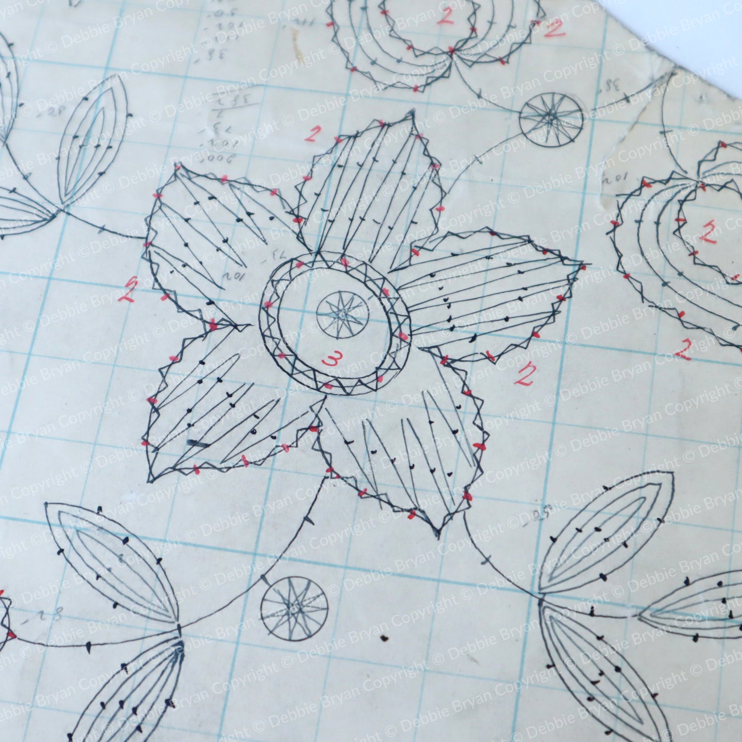 Detailed floral design on graph paper with measurements