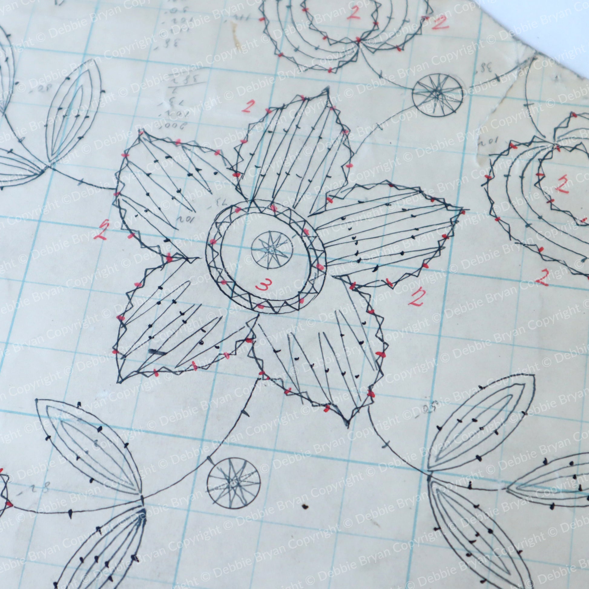 Detailed floral design on graph paper with measurements