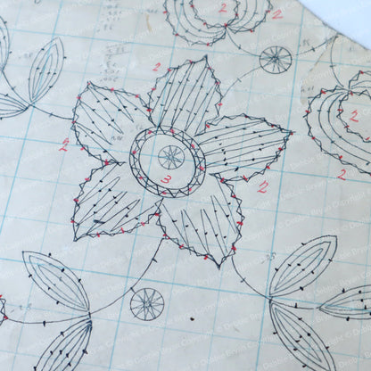Detailed floral design on graph paper with measurements