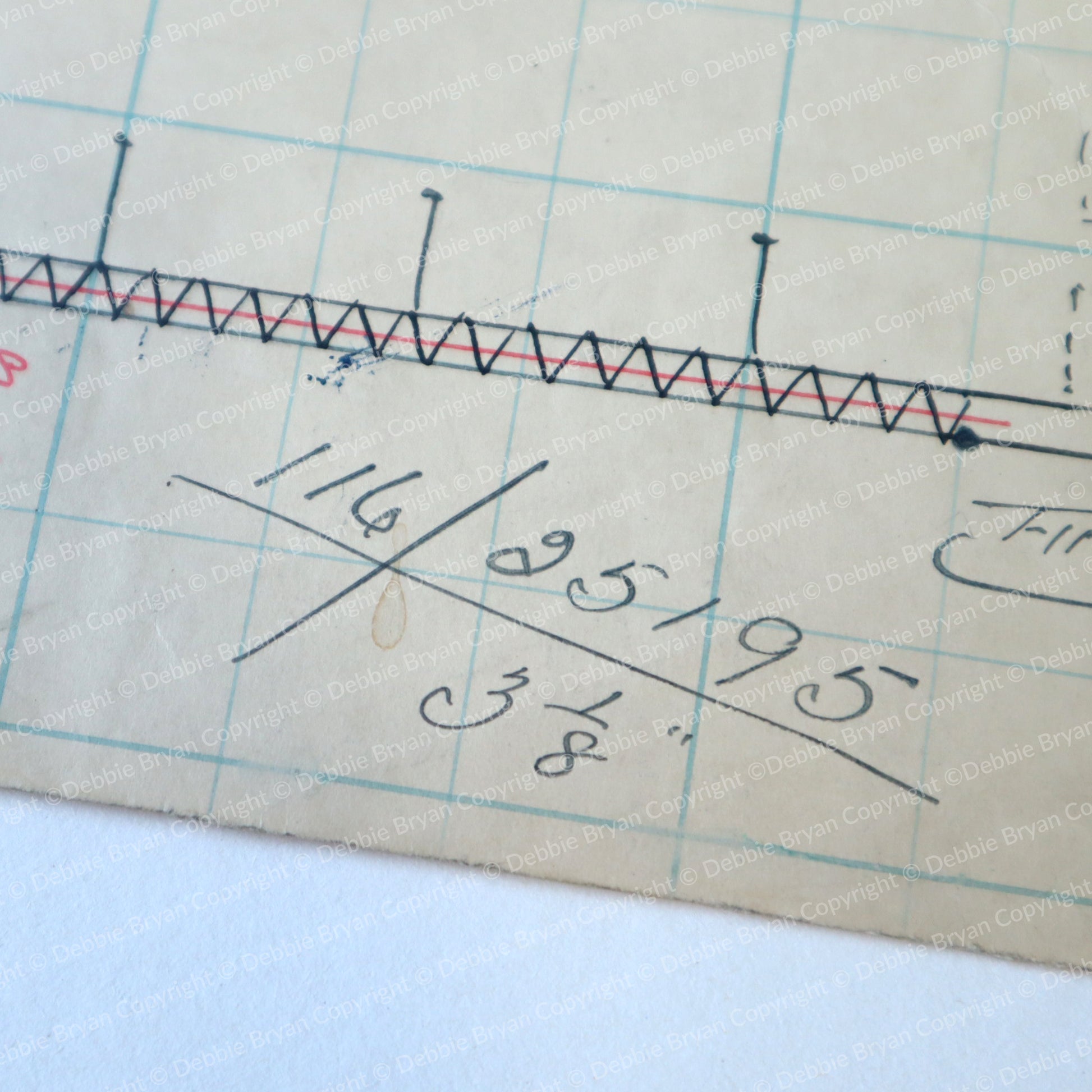 Measurement tool with grid background and measurements written on it