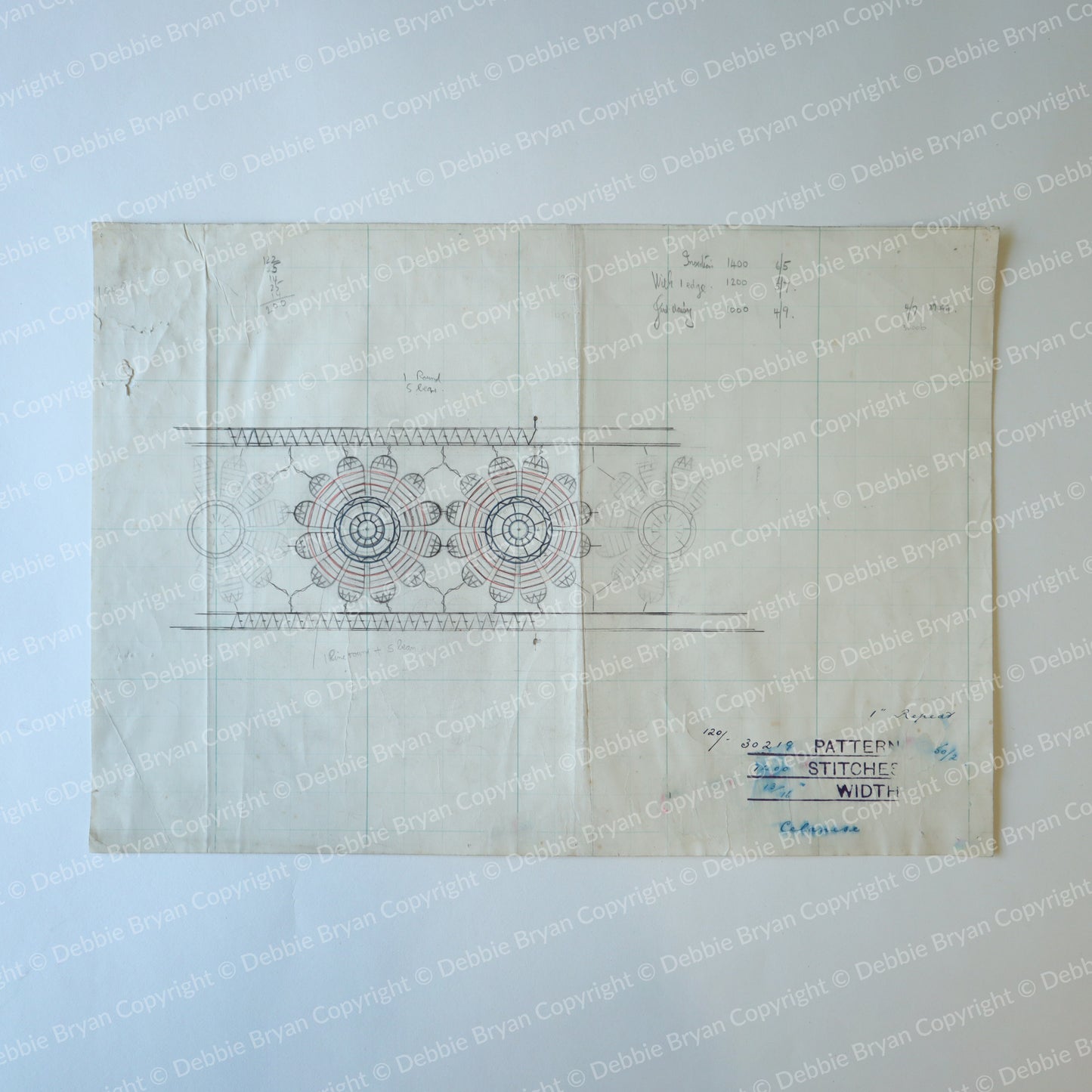 Vintage sewing pattern with lace design on a light blue background