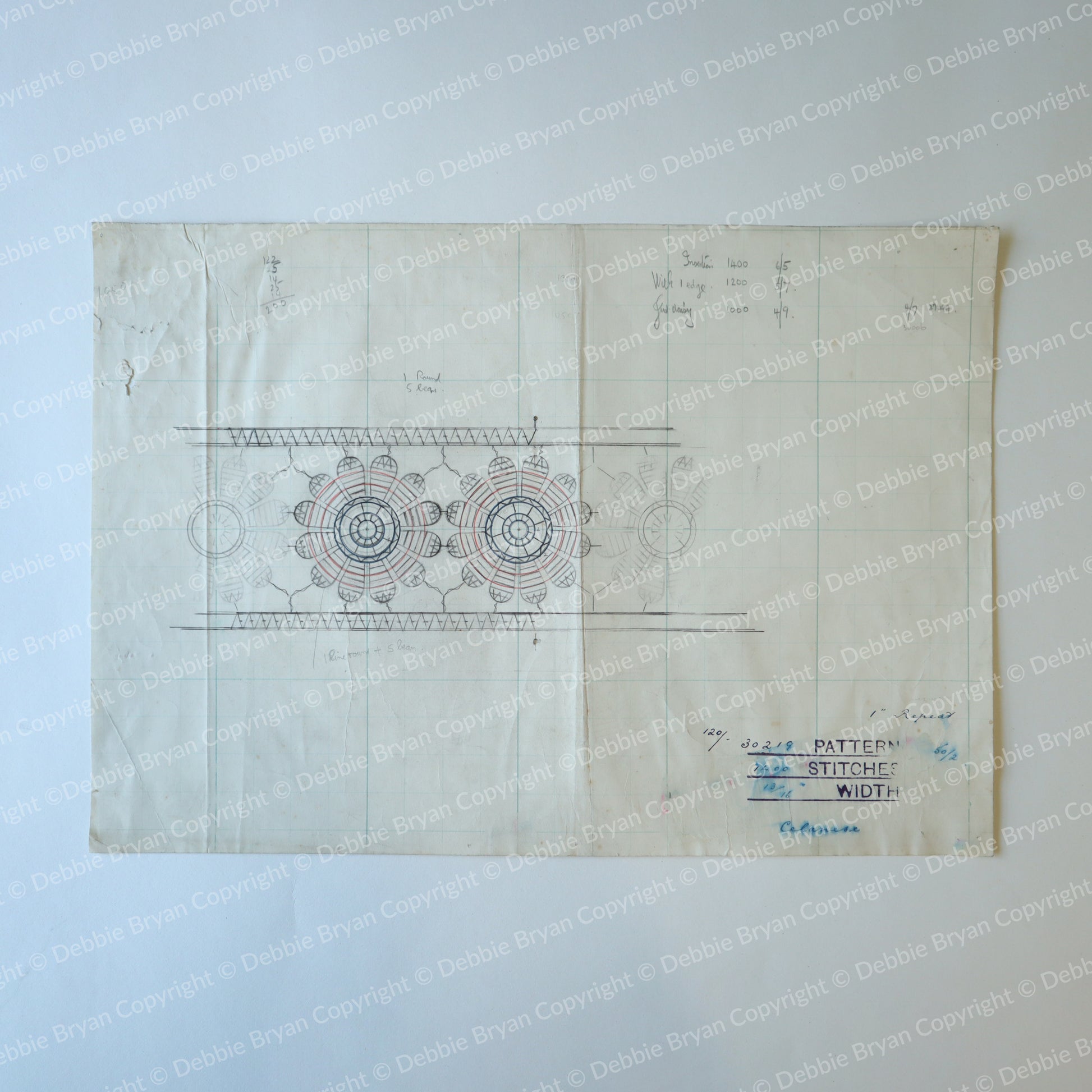 Vintage sewing pattern with lace design on a light blue background