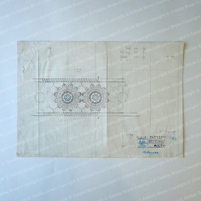 Vintage sewing pattern with lace design on a light blue background