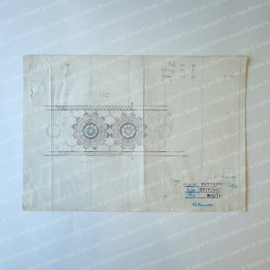 Vintage sewing pattern with lace design on a light blue background
