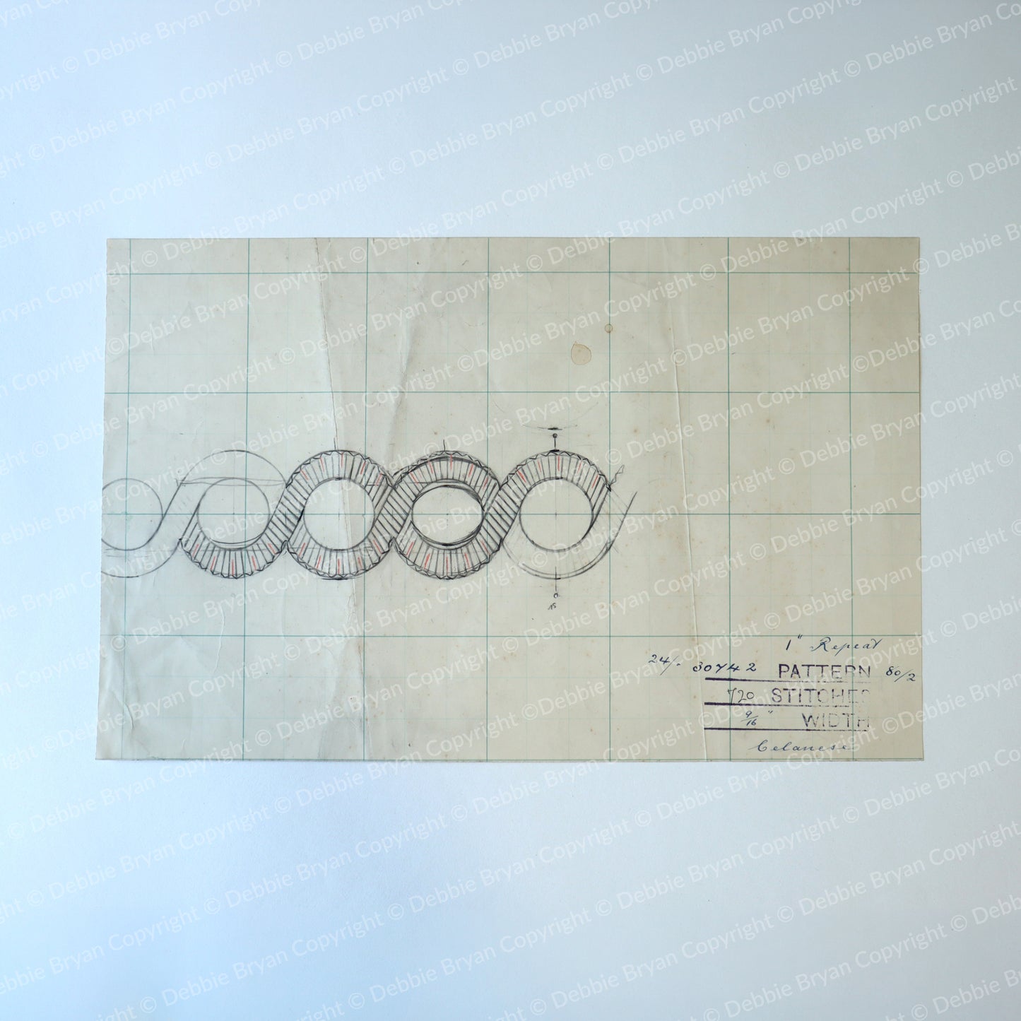 Technical drawing on graph paper with text and symbols