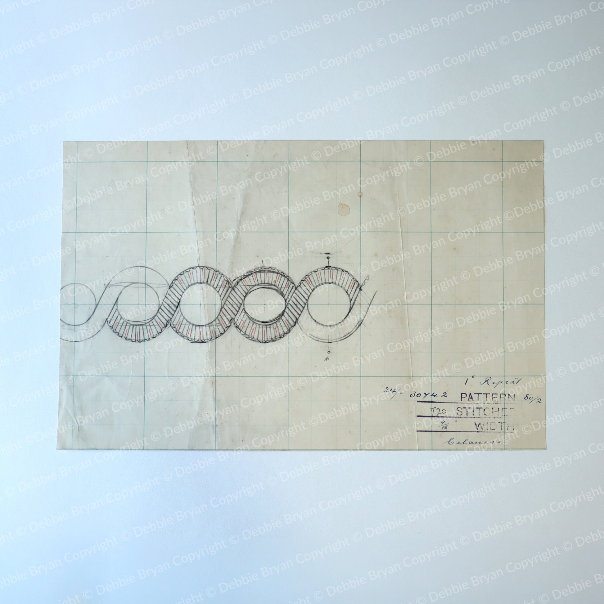 Technical drawing on graph paper with text and symbols