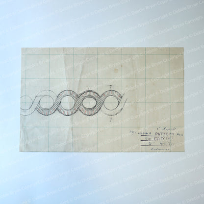 Technical drawing on graph paper with text and symbols