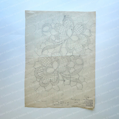Sheet of lace patterns with floral designs on a off white background