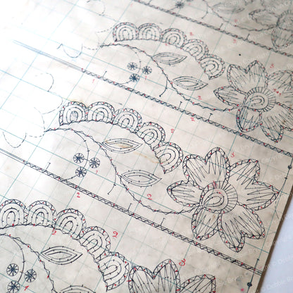Vintage lace pattern with measurements and designs on a white background