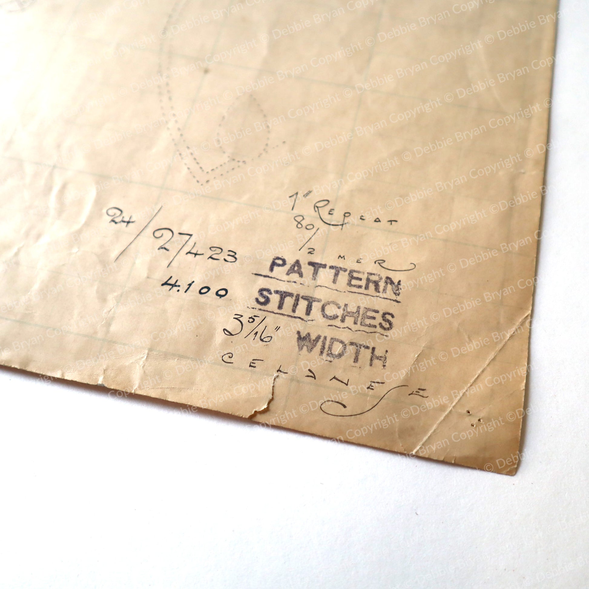 Brown paper bag with printed text on a white background