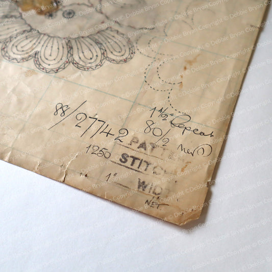 Vintage lace pattern with handwritten notes on a white background