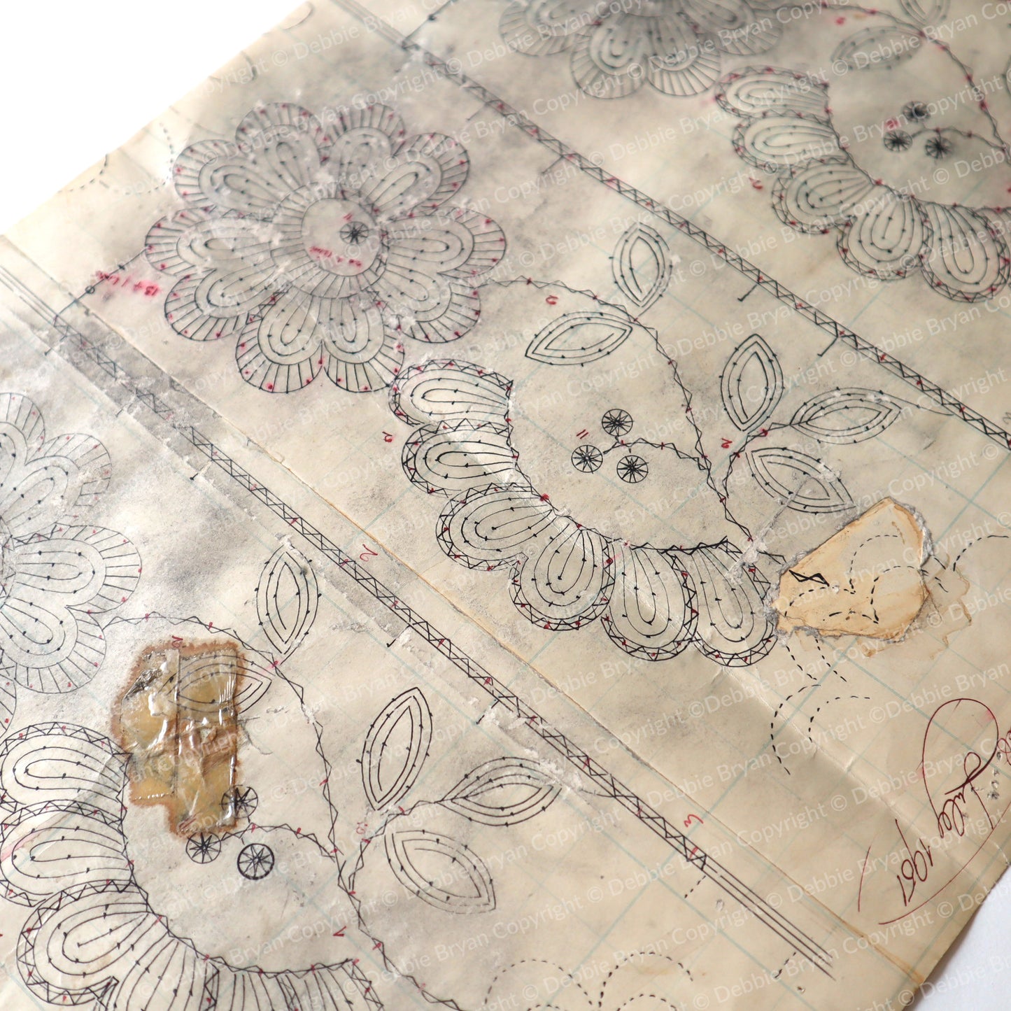paper with floral lace and decorative elements on a neutral background