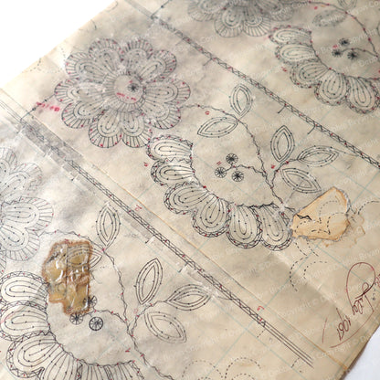 paper with floral lace and decorative elements on a neutral background