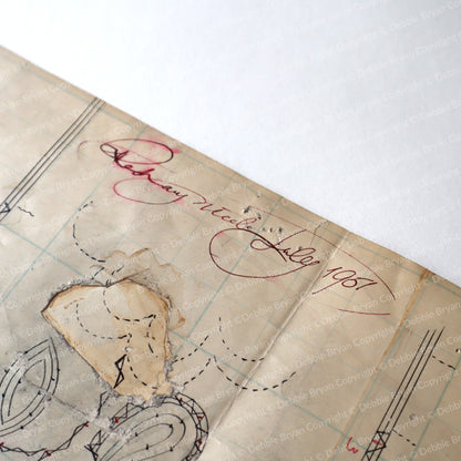Old document with handwritten text and a signature on a white background
