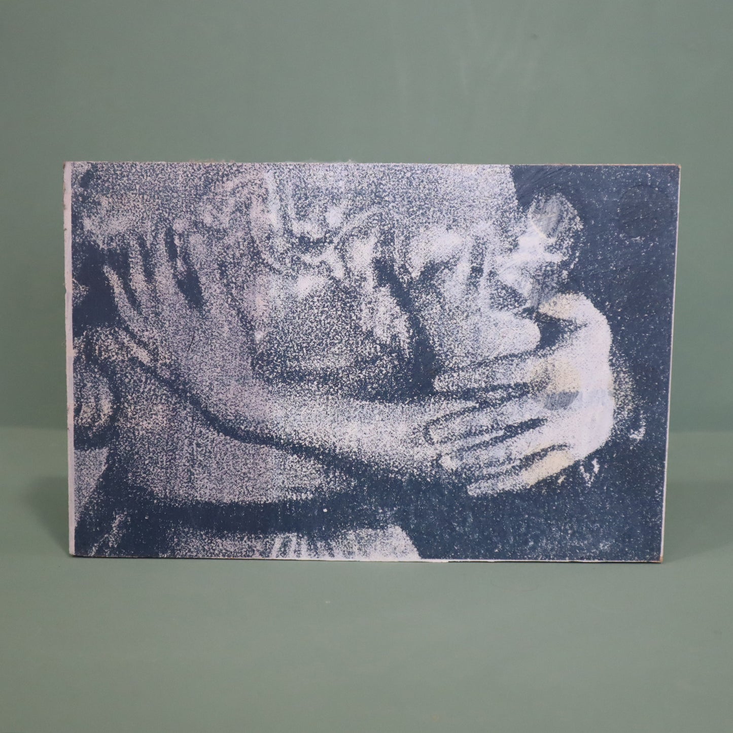 Textured artwork of a couple embracing on a gray background