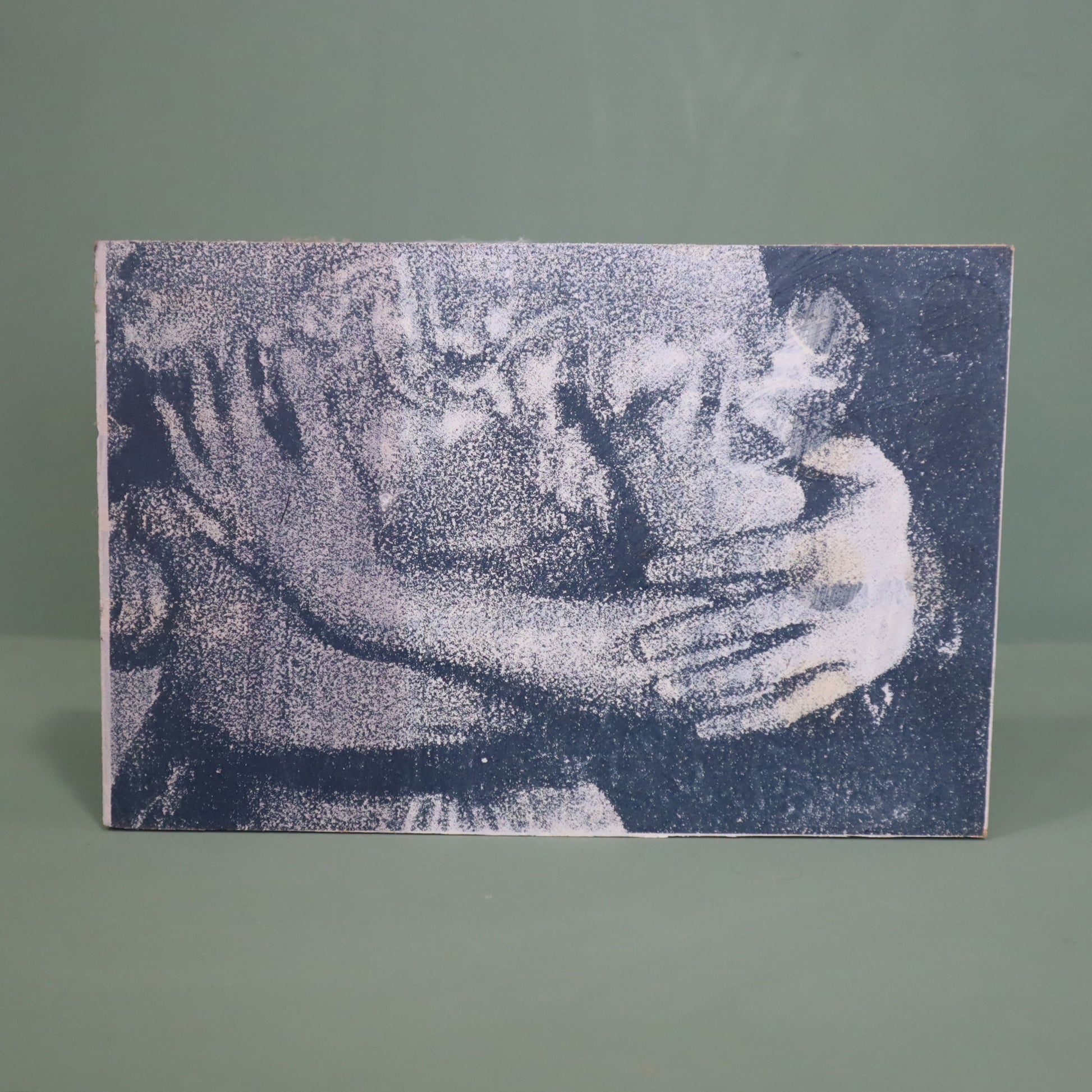 Textured artwork of a couple embracing on a gray background