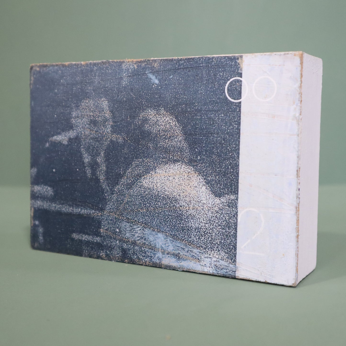 small wooden framed mixed media artwork by Peter Clayton on a green background