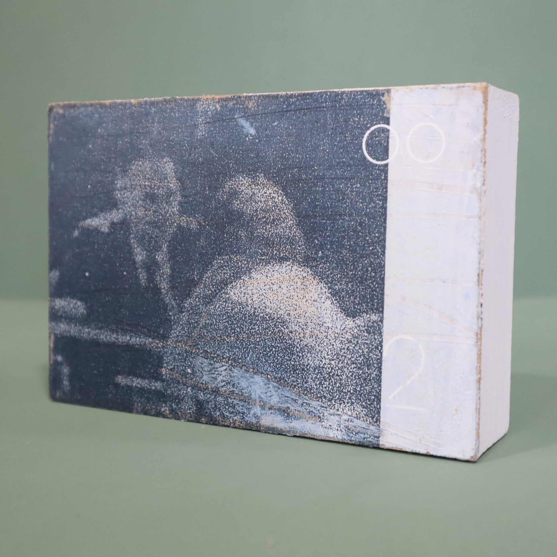 small wooden framed mixed media artwork by Peter Clayton on a green background