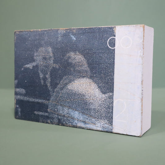 small wooden framed mixed media artwork by Peter Clayton on a green background