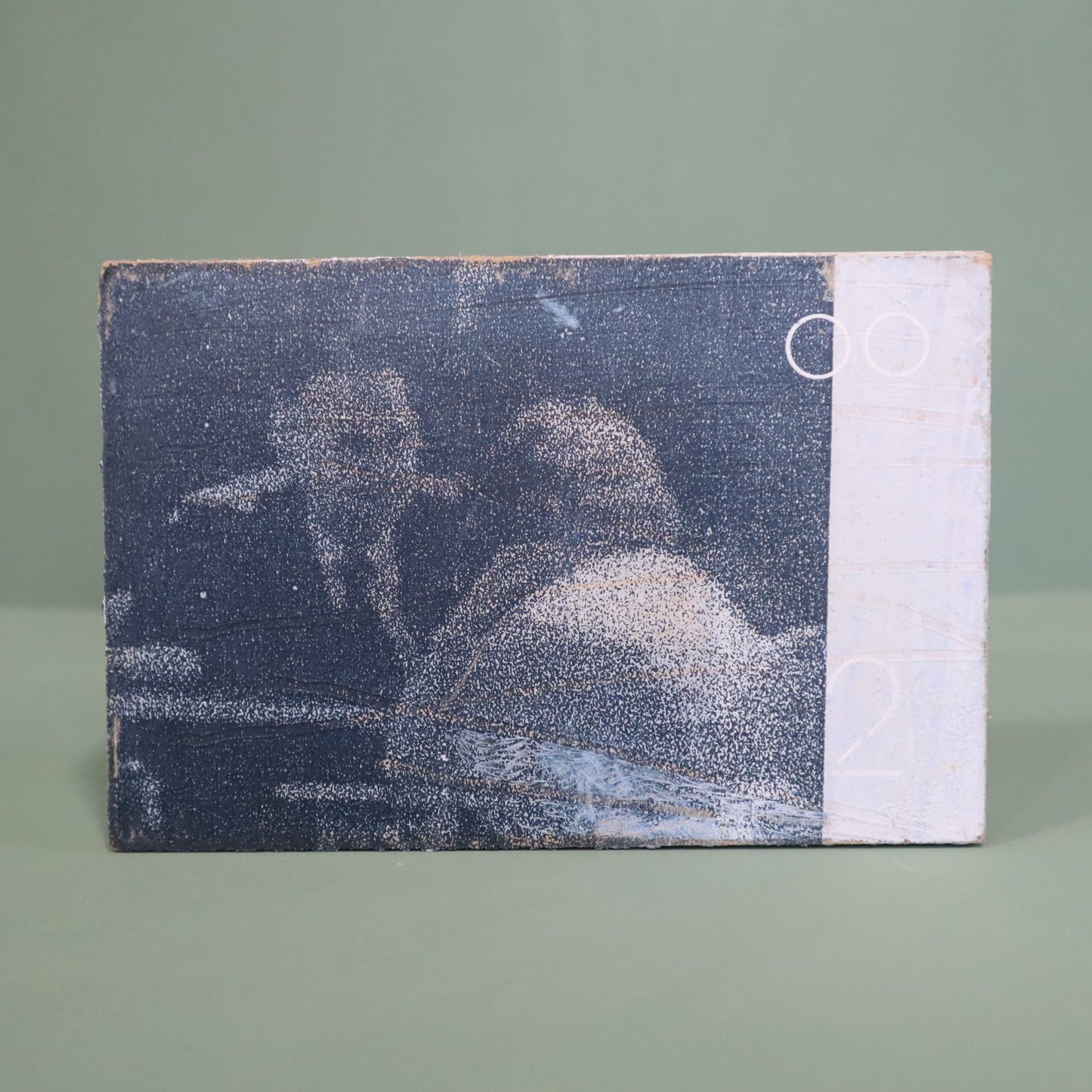 small wooden framed mixed media artwork by Peter Clayton on a green background