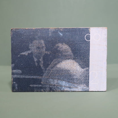 small wooden framed mixed media artwork by Peter Clayton on a green background