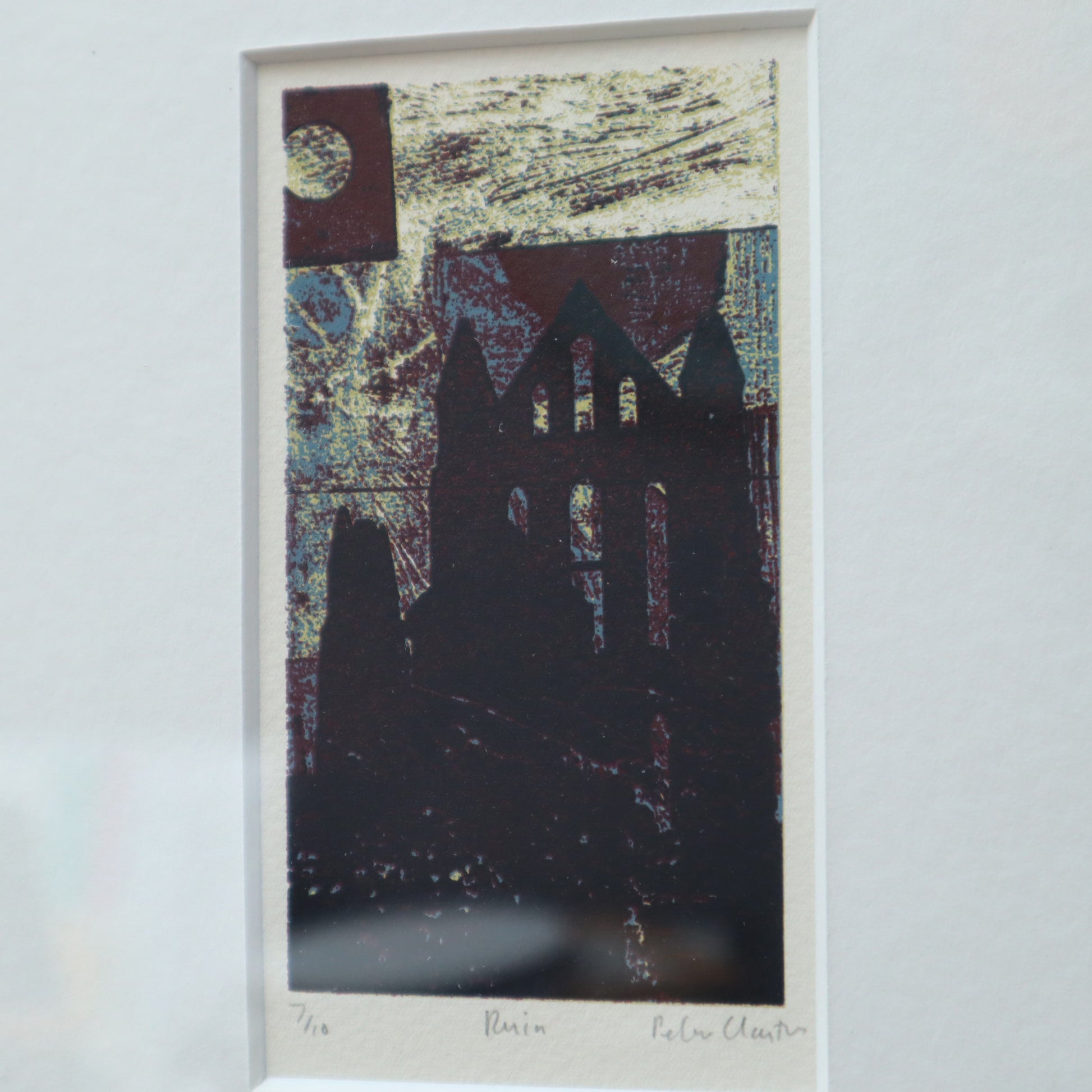 Framed abstract artwork with a silhouette of a building on a textured background