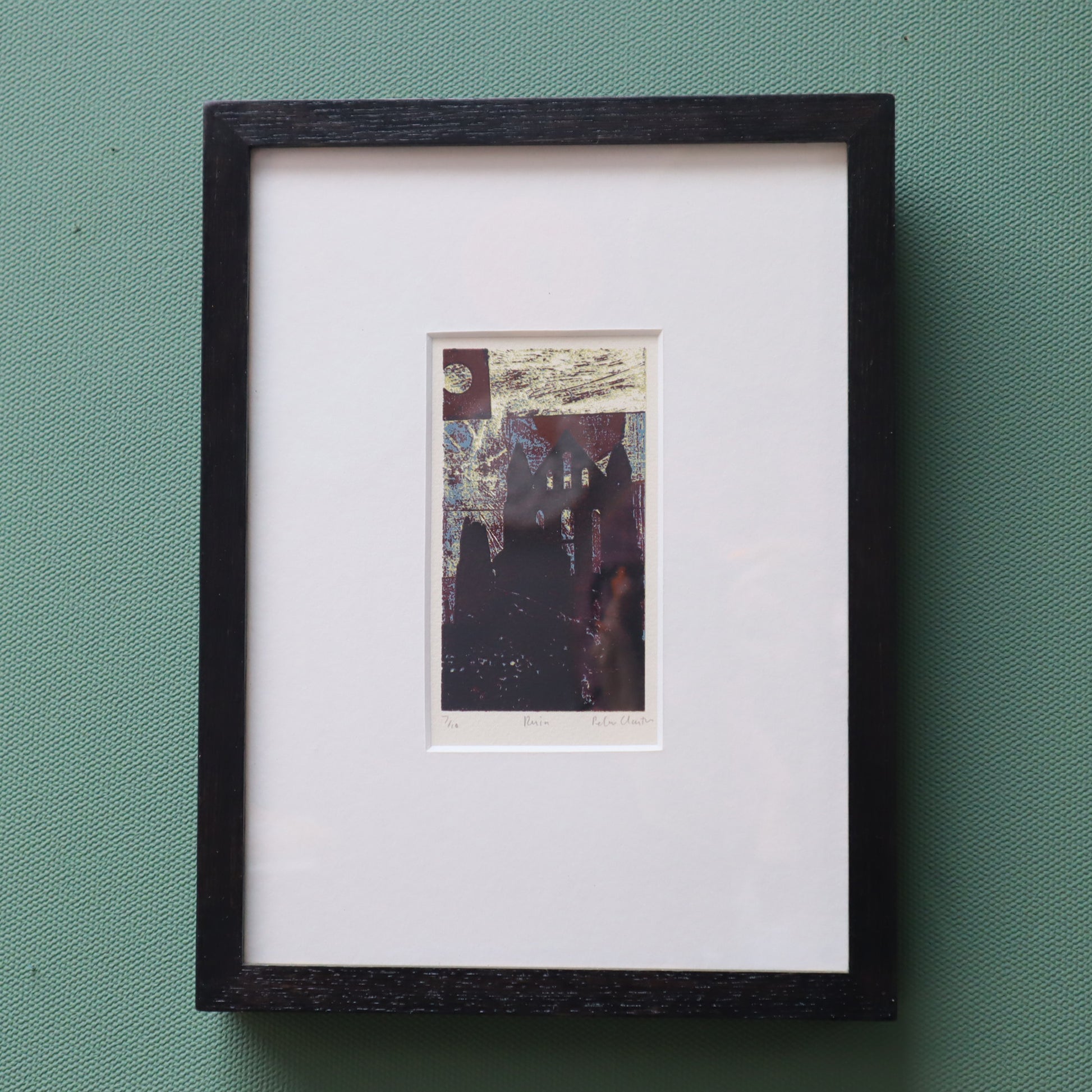 Framed artwork  Silk screen print of a ruin on a green wall