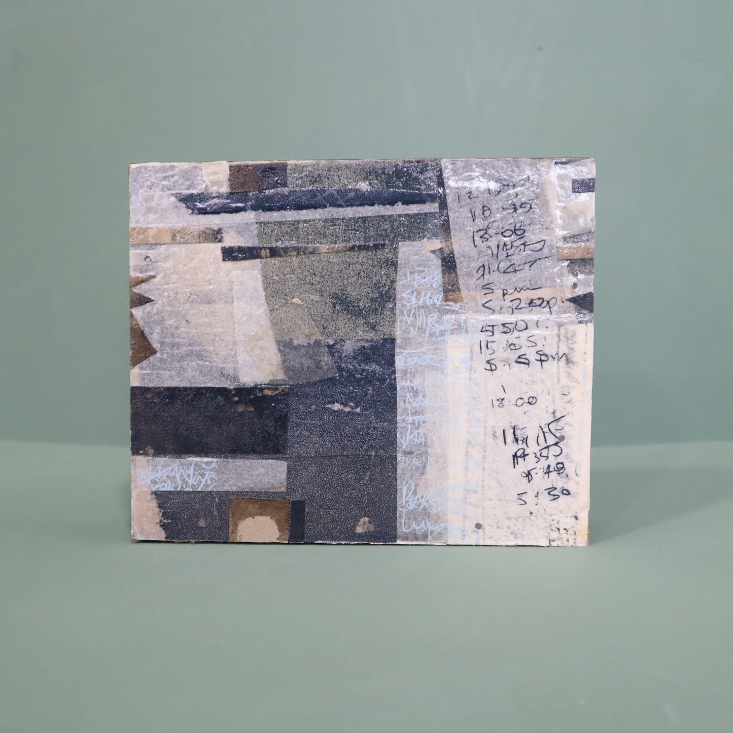 Abstract art piece with geometric shapes and text on a gray background