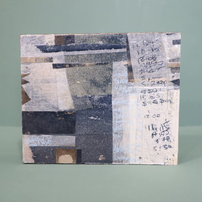 Abstract art piece with geometric shapes and text on a gray background