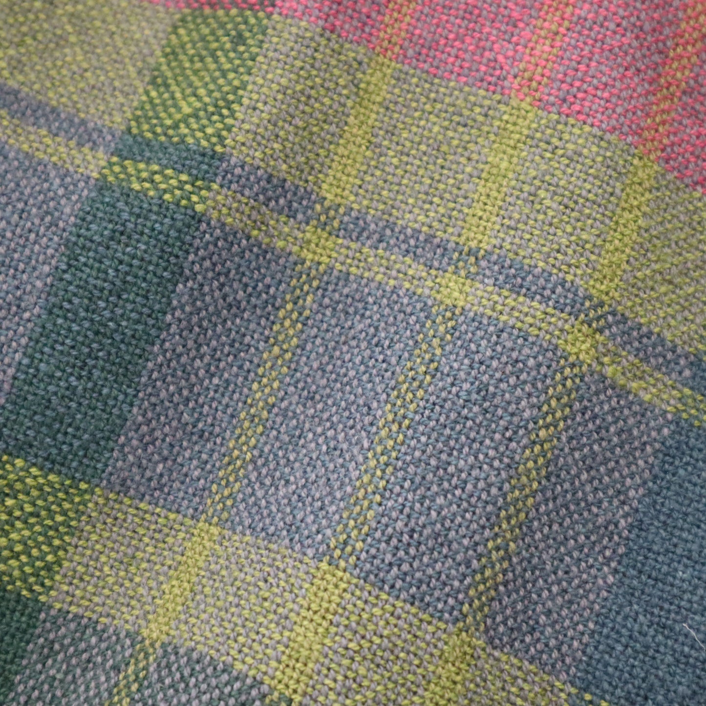 Hand woven fabric in a blue green red check pattern