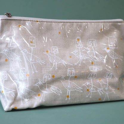 Linen washbag with plastic cover and an abstract design of birds holding placards with numbers on them
