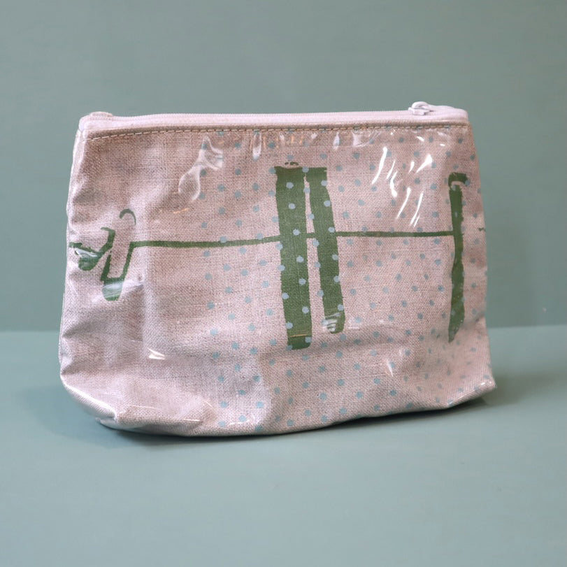 Linen washbag with plastic cover and an abstract green design of  a washing line