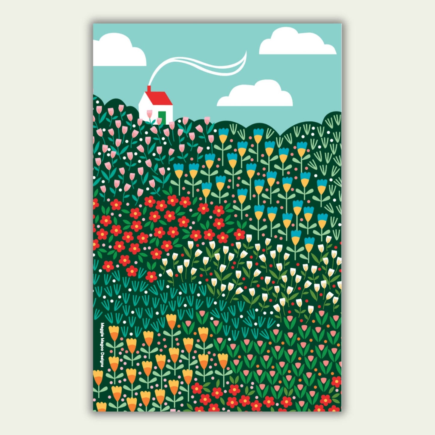 Hanging tea towel design with a bright meadow design and a white house with red roof in the top left corner