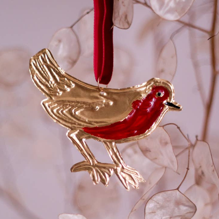 Handmade tin Christmas ornament in the shape of a robin