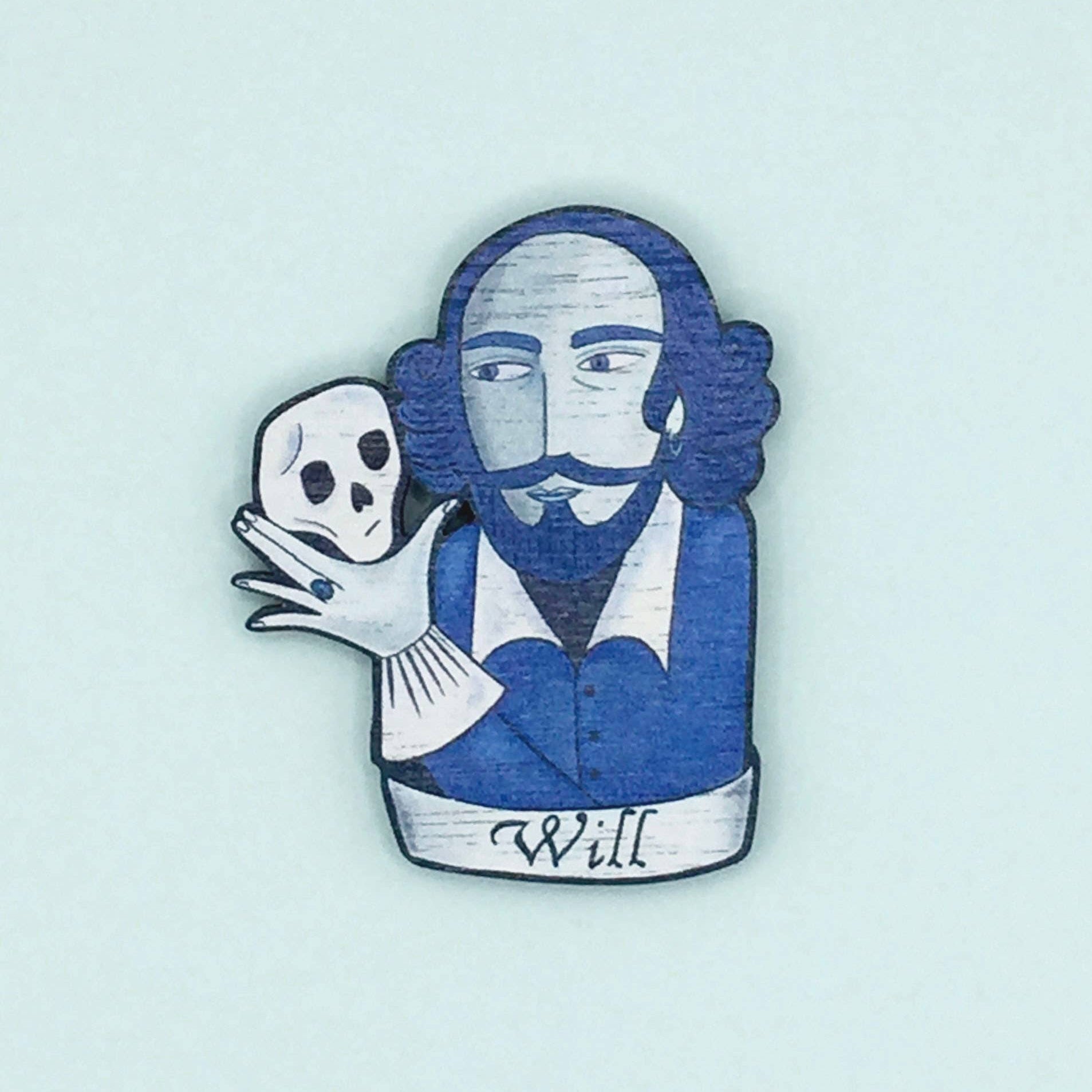 A wooden pin badge featuring William Shakespeare holding a skull