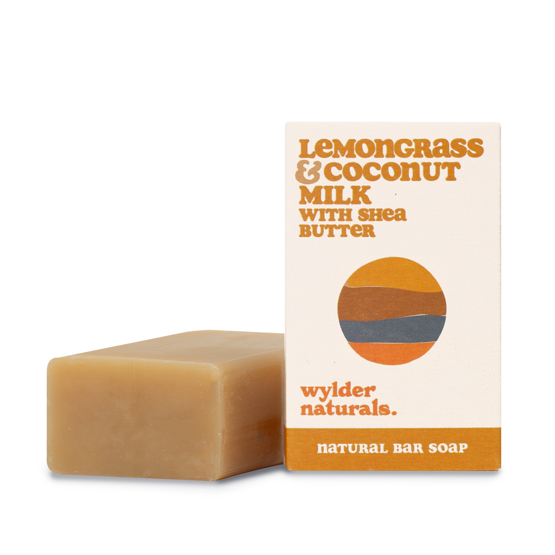 Bar soap sitting next to its packaging with branding labeled 'Lemongrass & Coconut Milk with Shea Butter' by wylder naturals