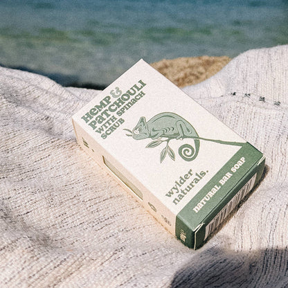 Box of bar soap laying on a grey lined by the side of the sea
